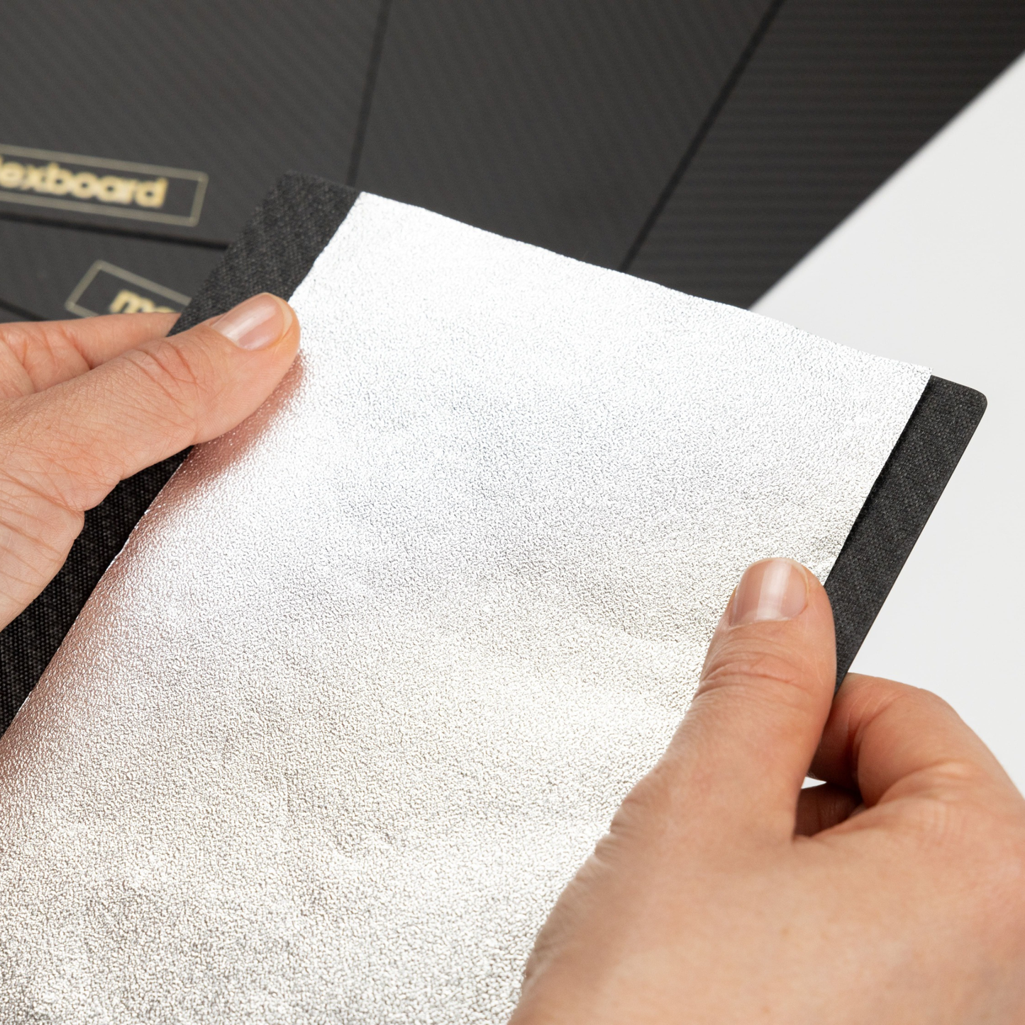 Foil held securely on carbon fiber foil board by malexboard for controlled hair coloring
